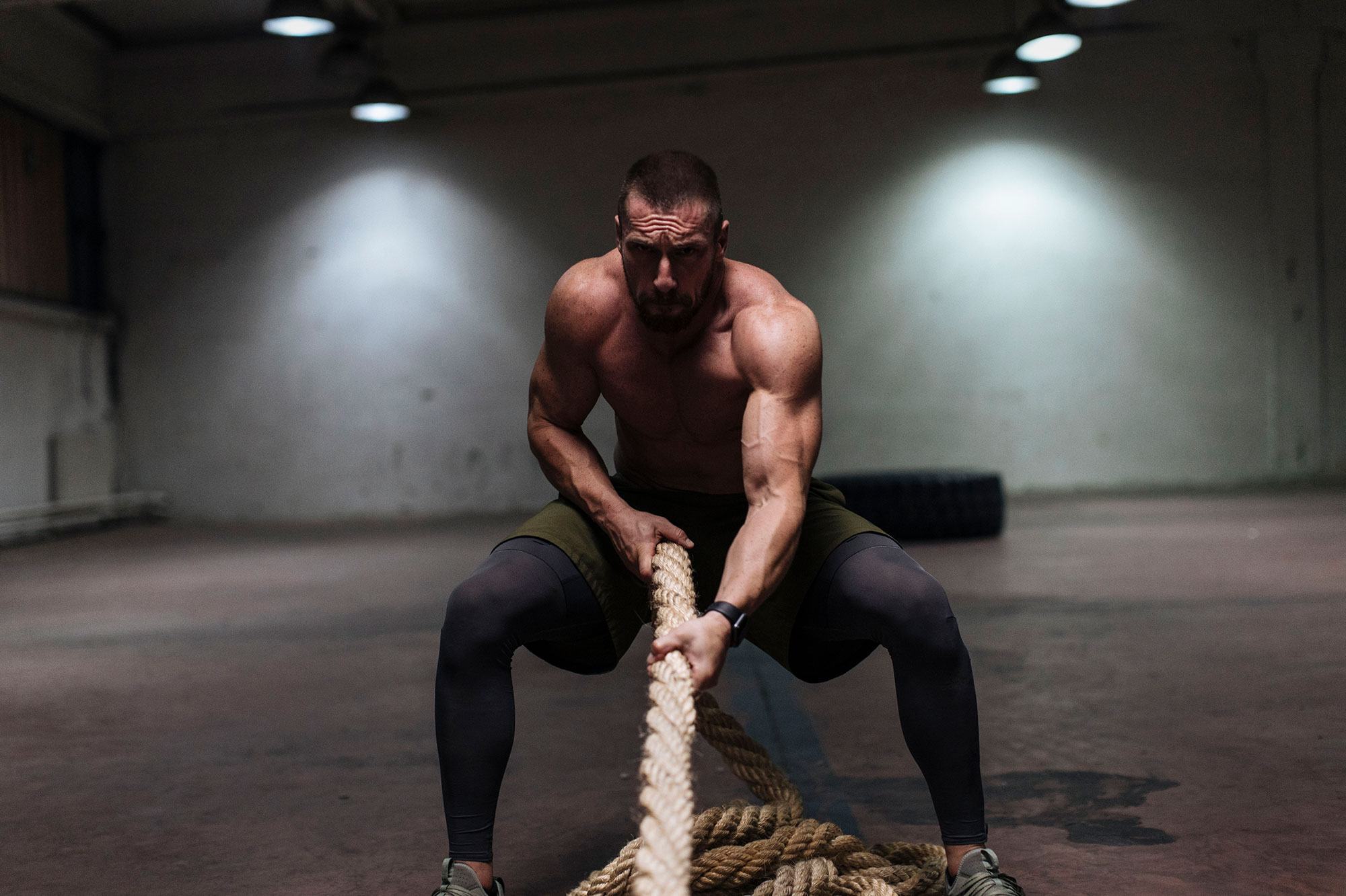 Man training with battle ropes